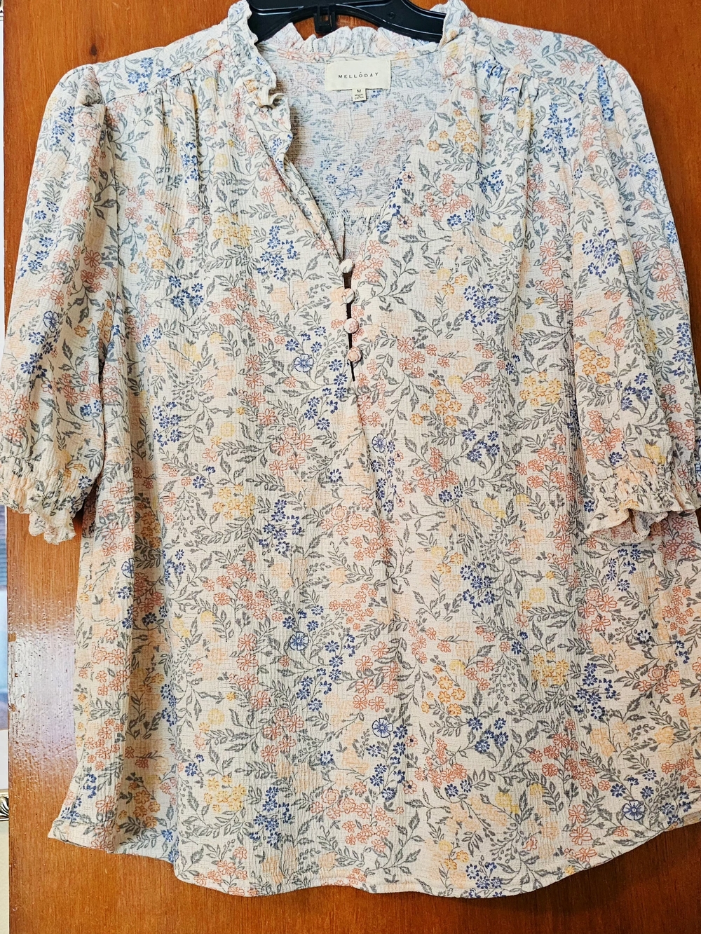 MELLODAY Cream Floral Ruffle-Neck Button Blouse with Blue & Peach Accents